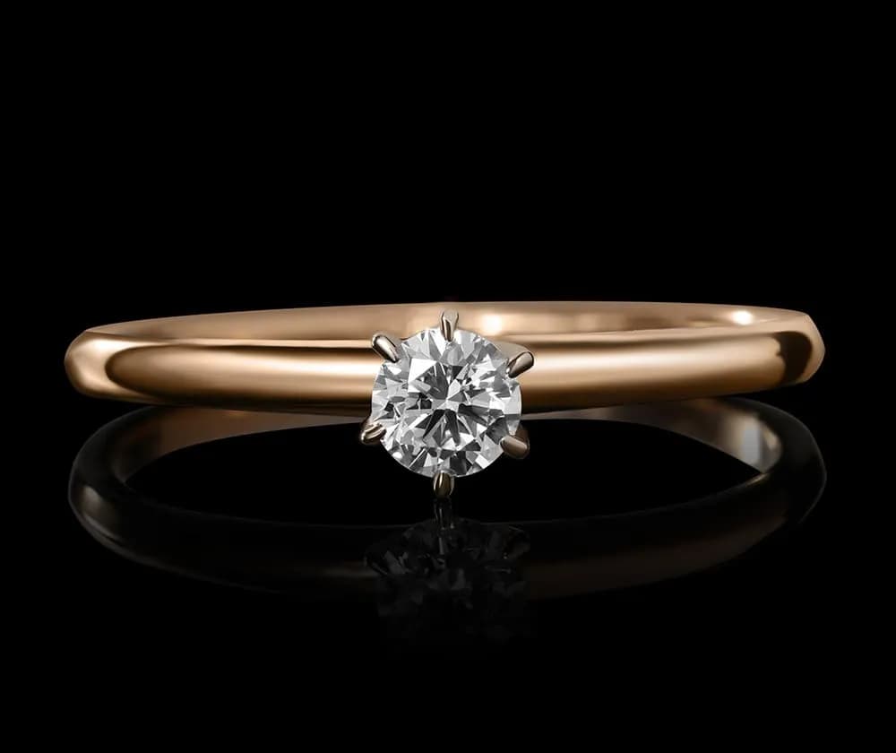 Каблучка з діамантом  ``Diamond`s forever`` з комбінованого золота 313-0379 (16,5)